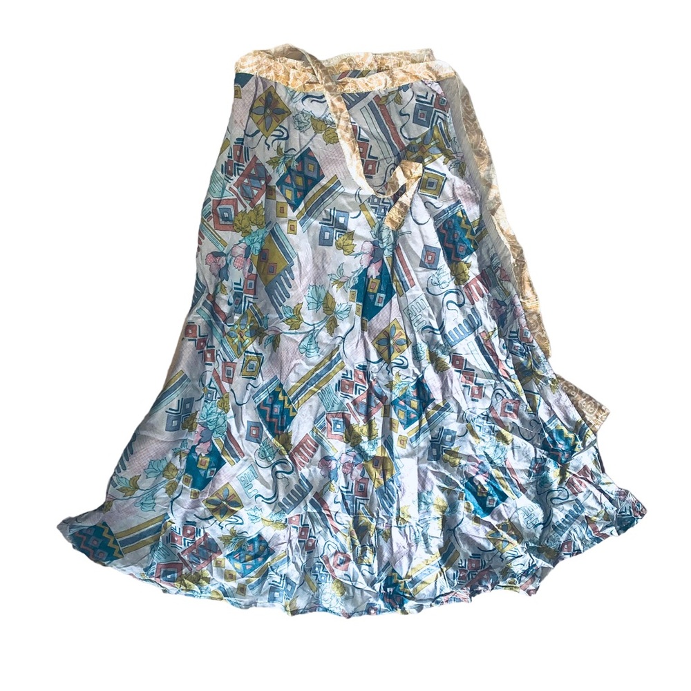Reversible maxi skirt with blue geometric on one side and gold swirls on other